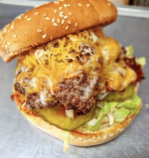 Photo of a burger with toppings.